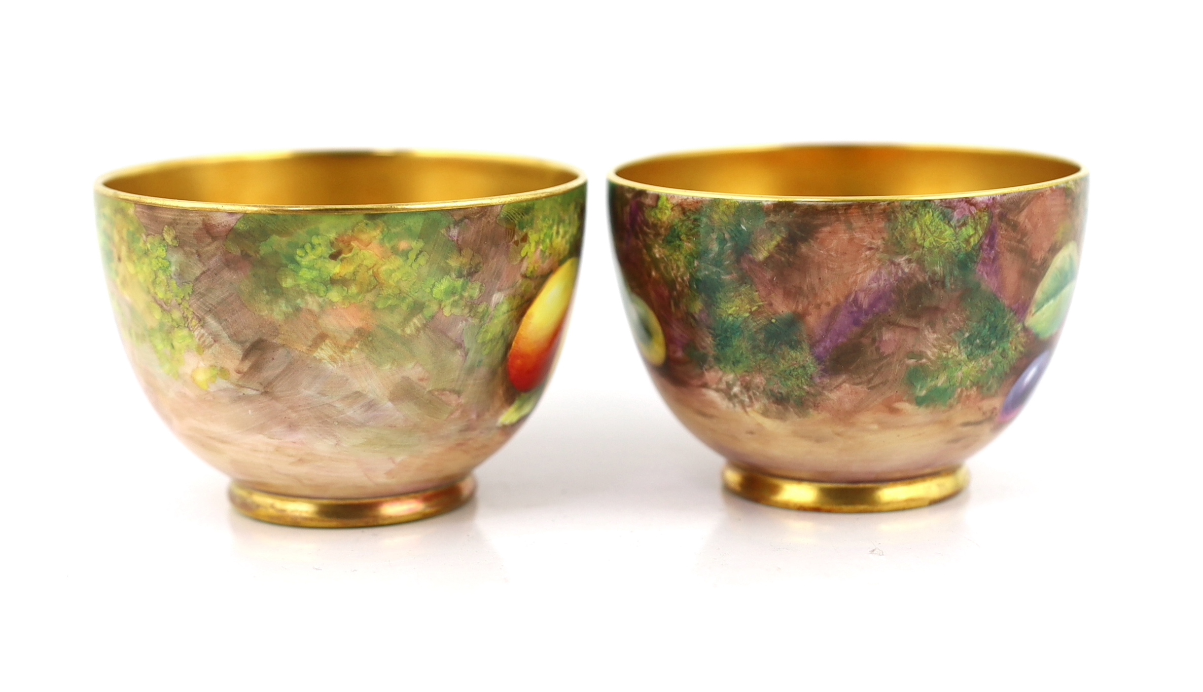 A pair of Royal Worcester fruit painted tea cups and saucers, 1960s
